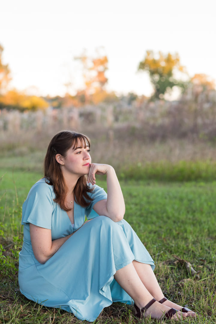 Graduation photo in a grass field